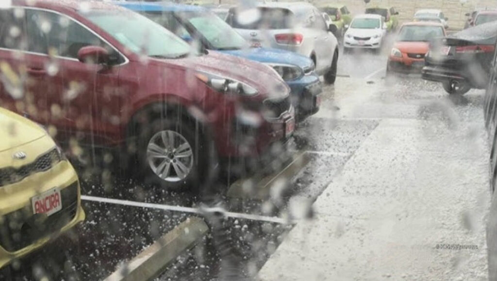 Cars in the rain on a rainy sales lot