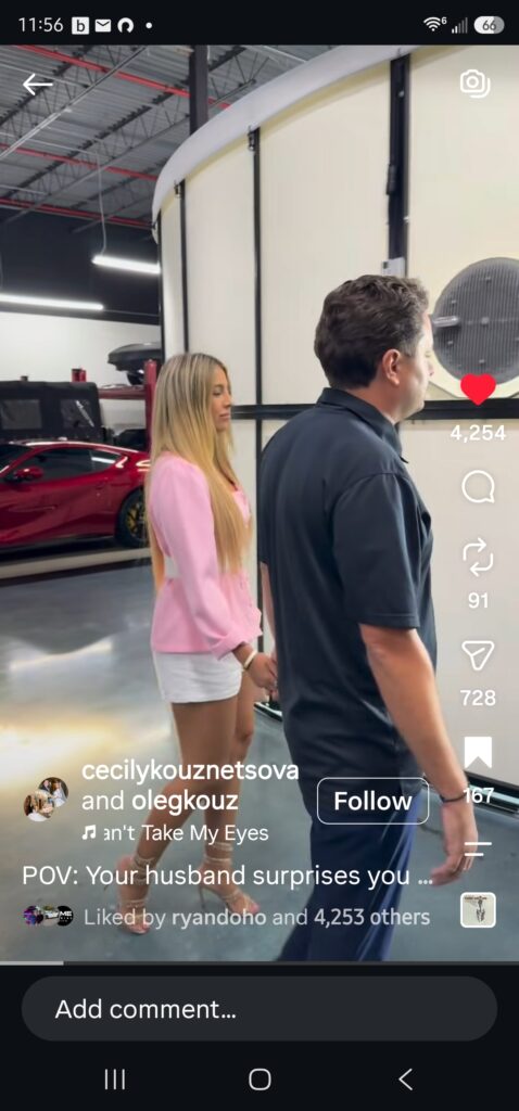 A man and a woman walk into a 360Booth car photo studio together