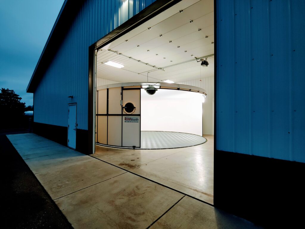 360Booth Vehicle Photo Studio in a dealership warehouse at night