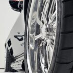 Close-up of a vehicle wheel and tire photographed for a dealership listing