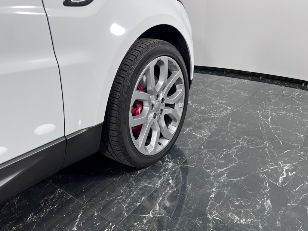 Close-up of a vehicle wheel and tire photographed for a dealership listing